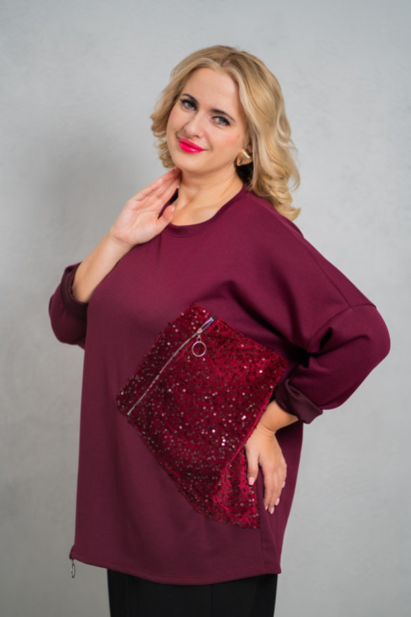 Stylowa bluzka z ozdobnymi suwakami i cekinową aplikacją